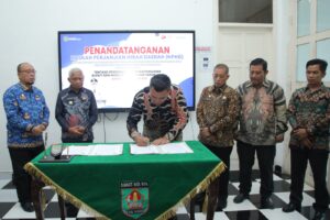 Bupati Asahan H Surya Tandatangani NHPD Anggaran Pemilu.